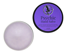 view of open tin of lavender colored hand salve with purple label that reads Psychic Hand Salve and ingredients