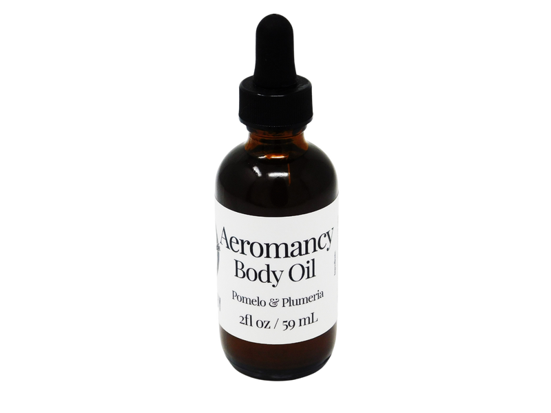 brown glass dropper bottle with white label that reads: aeromancy body oil. pomelo & plumeria. 2fl/ 59 ml