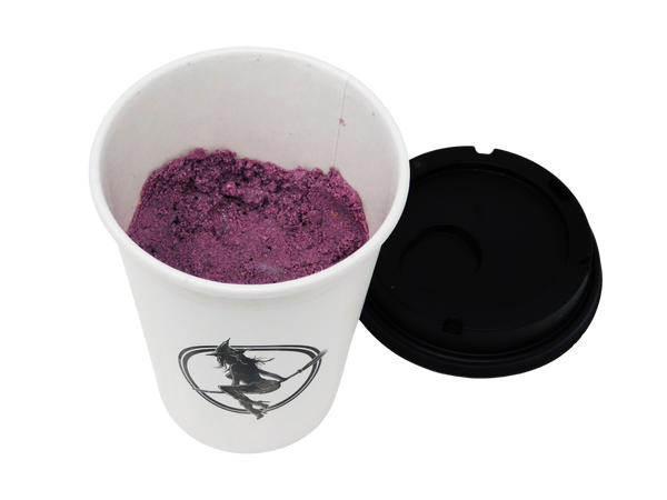 purple bath bomb inside a coffee cup