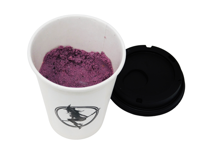 purple bath bomb inside a coffee cup