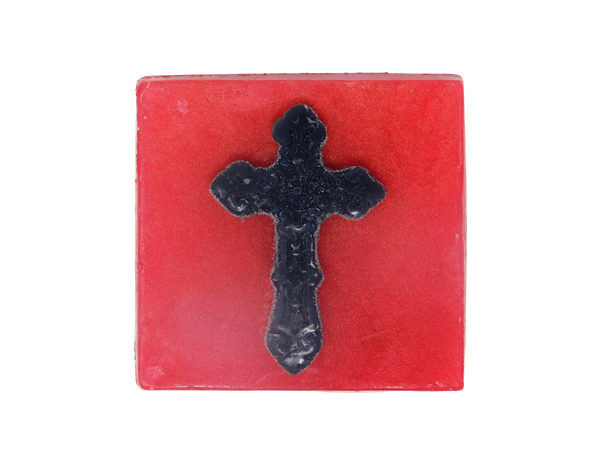 pink square shaped soap with black gothic cross
