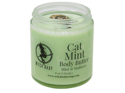 light spring green body butter in 4 oz glass jar topped with leopard skin jasper with a clear label that reads: cat mint body butter. mint & mulberry.