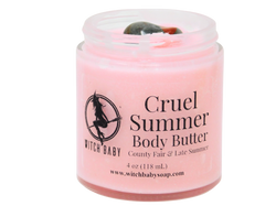 pink body butter in 4 oz glass jar with bloodstone on top and a clear label that reads: cruel summer body butter. county fair & late summer.