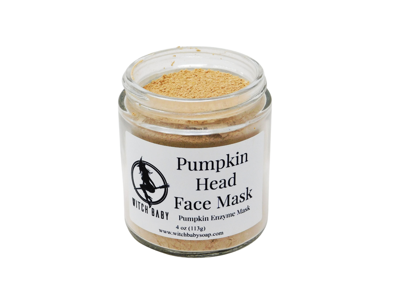 orange clay mask packaged in a 4 oz jar with white label that reads pumpkin head face mask. pumpkin enzyme mask. 