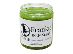 frankenstein green body scrub packaged in 8 oz glass jar with white label that reads Frankie Body Scrub. Green Apples & Crunchy Hay. 