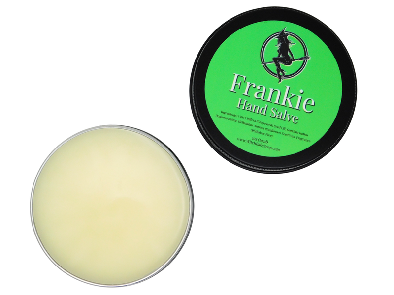 opened container of frankie hand salve exposing white salve inside 2 oz black tin with green label that reads: Frankie Hand Salve and has ingredients listed below