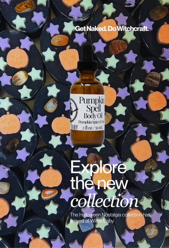 An amber glass bottle of Pumpkin Spell Body Oil centered over a repeating pattern of dark circular soaps decorated with orange pumpkins, pastel star shapes, and small natural stones. White text at the top reads 'Get Naked. Do witchcraft. Explore the new collection. The Halloween Nostalgia collection has arrived at witch baby