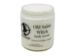 8 oz glass jar filled with thick white shimmery body scrub. Clear label reads: Old Saint Witch Body Scrub. Cherries & Sugar Cookies. 