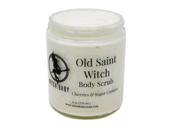 8 oz glass jar filled with thick white shimmery body scrub. Clear label reads: Old Saint Witch Body Scrub. Cherries & Sugar Cookies. 