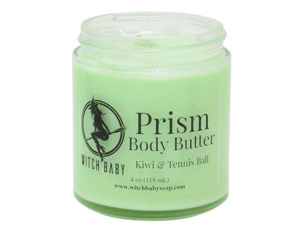 Green body butter made with Shea butter, coconut oil, and sunflower oil that smells like kiwi, starfruit, and tennis balls and topped with clear quartz.