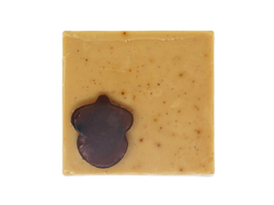 light brown coffee speckled square soap  with dark brown acorn shaped soap on top