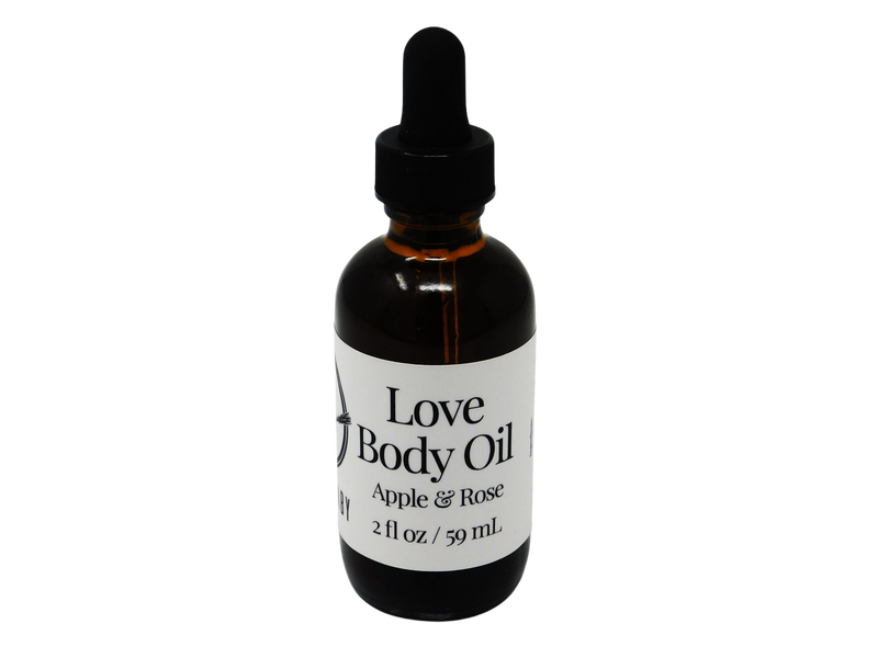 brown glass dropper bottle with label that reads: Love Body Oil. Apple & Rose. 