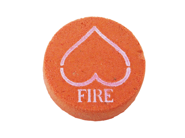 red circular bath bomb with pink mica airbrushed on top in the shape of an upside down heart to look like the upside down triangle element for fire and in text below the heart it says FIRE