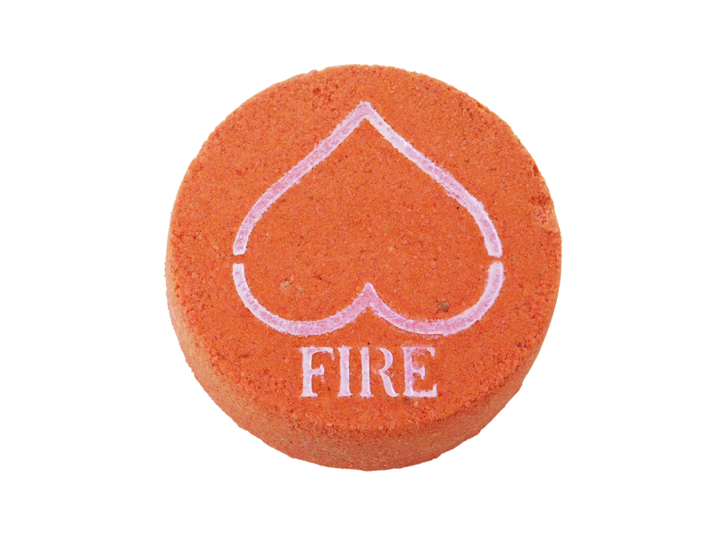 red circular bath bomb with pink mica airbrushed on top in the shape of an upside down heart to look like the upside down triangle element for fire and in text below the heart it says FIRE