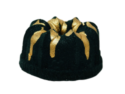 Black cake shaped bath bomb with gold glitter dripped on top. 