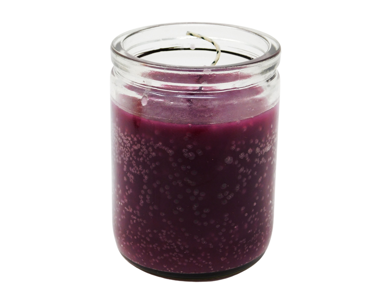 purple candle in glass jar