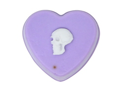 Pastel purple heart shaped soap with white skull on top.