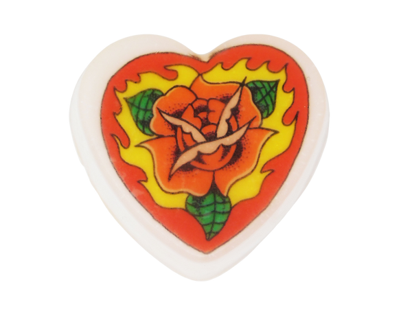 heat shaped soap with embedded image of a a tattoo style illustration of a red rose on fire inside a red heart