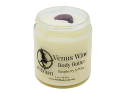 4 oz glass jar filled with white body butter and topped with rhodonite. Clear label reads Venus Wine Body Butter. Raspberry & Wine.