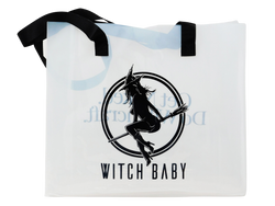 witch baby logo on one side of purple translucent tote bag with black handles