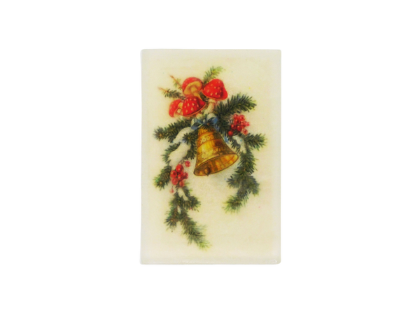 A rectangle shaped glycerin soap that smells like snow covered juniper trees, blackberry mead, cocoa, and peppermint, and has a vintage yuletide christmas holiday greeting card image of a mushroom and winter foliage covered bell with snow on it.
